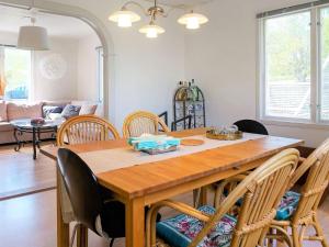 a dining room with a wooden table and chairs at 8 person holiday home in BILLINGSFORS in Billingsfors +22 photos