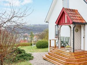 a small gazebo on the side of a house at 5 person holiday home in BÅSTAD in Båstad