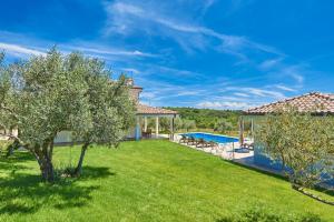 an image of a yard with a swimming pool at Villas Montrin in Kaštel