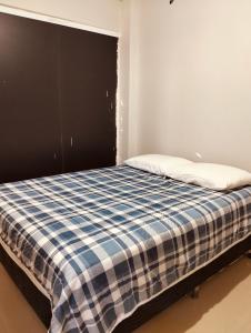 Ένα ή περισσότερα κρεβάτια σε δωμάτιο στο Apartamento temporada PNZ