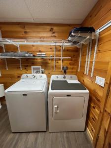 a stove and a washer and dryer in a room at Hillside Hideaway Cabin in Blairsville +37 photos