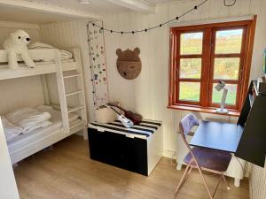 a room with two bunk beds and a desk at LF11124-Struer-Vesterkaervej-24 in Struer