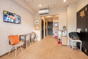 a waiting room with chairs and a counter in a hospital at Riverview APT, Asakusa-Skytree area, 4 min to Metro in Tokyo