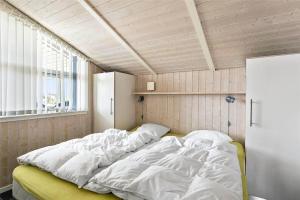 a bedroom with a large bed with white sheets at LF550-Vestervig-Ingersvej-20 in Vestervig