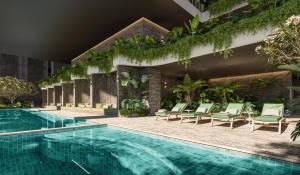 a swimming pool next to a building with green plants at Velvet Dusk Suite @ Lv 29 on the new Star Casino in Brisbane