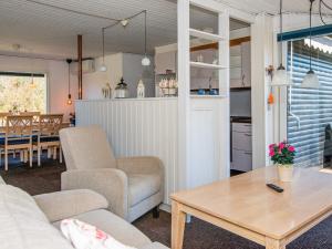 a living room with a couch and a table at 6 person holiday home in Glesborg in Glesborg +29 photos