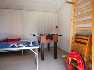 a toy room with a table and a desk at 6 person holiday home in Glesborg in Glesborg