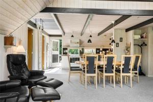 a kitchen and dining room with a table and chairs at LF12017-Spottrup-Albaekparken-144 in Spottrup