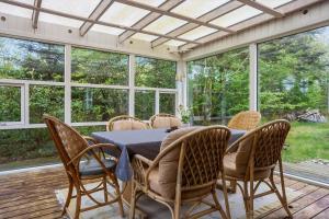 a dining room with a table and chairs at LF14138-Spottrup-Heden-11 in Spottrup +13 photos