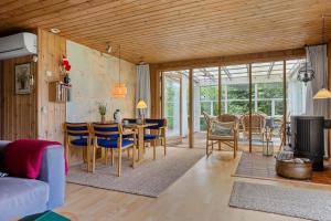 a kitchen and dining room with a table and chairs at LF14138-Spottrup-Heden-11 in Spottrup
