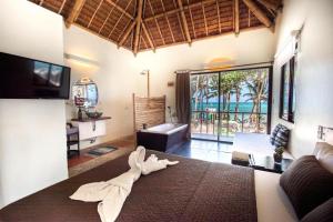 a living room with a towel laying on a bed at Hangin Kite Resort in Boracay