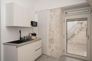 Kuchyň nebo kuchyňský kout v ubytování Domus Isola - Cisternino