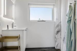 a bathroom with a sink and a window at LF12257-Hjerm-Livbjerggardvej-57 in Hjerm