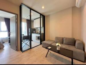 a living room with a couch and a table at The Base Pattaya Seaview Condo in Pattaya