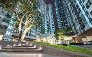 a fountain in a city with tall buildings at The Base Pattaya Seaview Condo in Pattaya Central