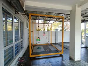a frame on the side of a building at KLIA Guesthouse-3 bedroom 2 bathroom in Banting