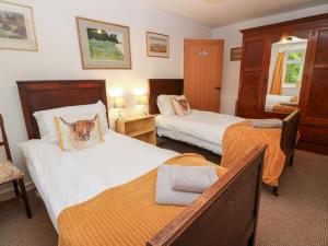 Postel nebo postele na pokoji v ubytování Charlies Cottage