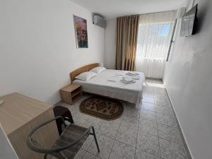 Ένα ή περισσότερα κρεβάτια σε δωμάτιο στο Hotel Camelia +12 φωτογραφίες