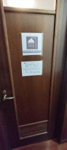 a brown door with a sign on it at Kanupata - Vacation STAY 18612 in Ishigaki Island