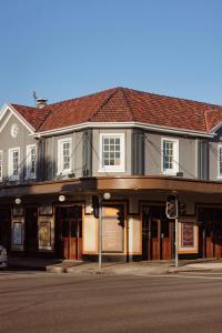 a building on the corner of a street at Islington Barracks Hotel in Hamilton