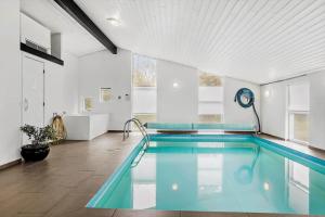 a large swimming pool in a white room with at LF160-Vestervig-Gunhildsvej-60 in Vestervig
