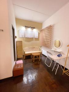 a living room with a couch and a table at Golden House 18 in Ipoh