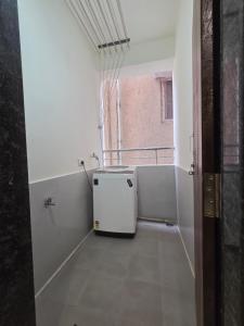an empty room with a radiator in a room with a window at SE 101 residential apartment in Kondapur