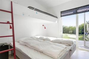 a white bedroom with a large bed with white sheets at LF299-Vestervig-Ingersvej-21 in Vestervig
