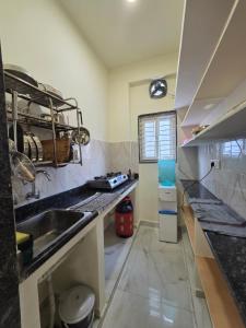 a kitchen with a sink and a counter top at SE 101 residential apartment in Kondapur