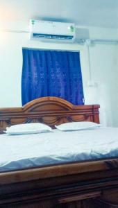 Ένα ή περισσότερα κρεβάτια σε δωμάτιο στο Amaravati homestay