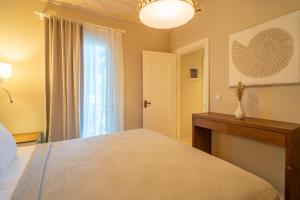 a bedroom with a large bed and a window at Akdeniz Bahçesi Apart Hotel by Kimera Lounge in Cıralı +147 photos
