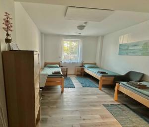 En eller flere senge i et værelse på Penzion Zastávka u Brna