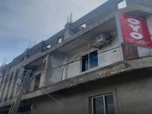 a building with a sign on the side of it at Hotel O Prince Residency in Bhubaneshwar