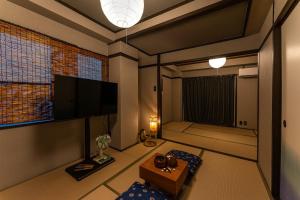 TV a/nebo společenská místnost v ubytování おやど紀伊国屋新大工町