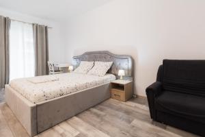 En eller flere senge i et værelse på Luxury Radox Brasov 94