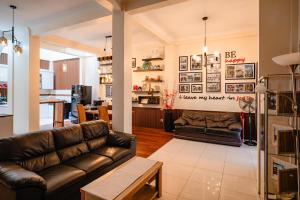 a living room with a couch and a table at INEZ Homestay in Timuran