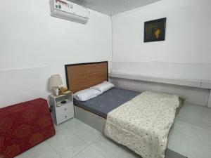 Postel nebo postele na pokoji v ubytování Homestay & Cafe Xã Đảo