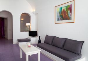 Uma televisão e/ou sistema de entretenimento em Whitedeck Santorini
