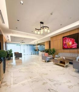 a lobby with a large room with couches and tables at CASA UMBER - JTOWER behind SM JMALL in Mandaue City