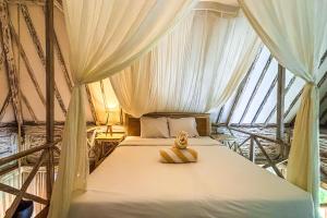a bedroom with a bed in a tent at Villa Alisha Pererenan Canggu in Canggu +103 photos