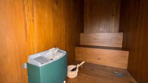a corner of a room with a green refrigerator at Modern 2BR Resort Apartment with Pool & Gym, Malabe in Malabe +2 photos