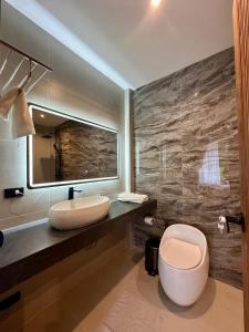 a bathroom with a sink and a toilet at POSH VILLA, jungle view, pool, BanTai in Ban Nua