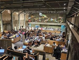 a group of people sitting in a lecture hall at Gongrim Stay in Seoul
