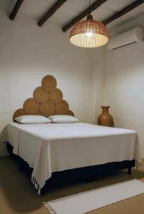 Postel nebo postele na pokoji v ubytování Vila Anderú Caraíva Suítes + 18 fotografií