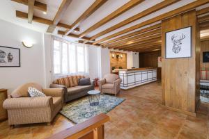 a living room with couches and a table at Hotel Razlog in Razlog