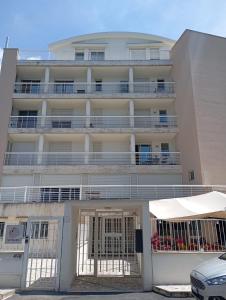 an apartment building with a gate in front of it at Modern and bright apartment in Rome