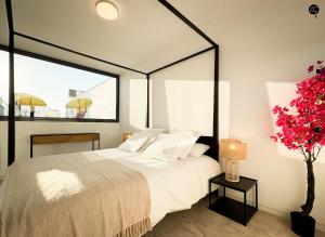 a bedroom with a large bed with a large window at Villa Poseidon Grupo AC Gestion in Zahara de los Atunes +15 photos