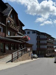 a group of people standing outside of a building at Apartmán MONTARA in Donovaly