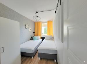 Ένα ή περισσότερα κρεβάτια σε δωμάτιο στο Pomorska Rooms