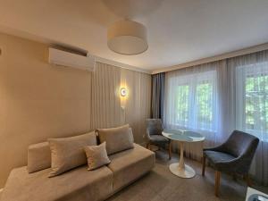 a living room with a couch and a table at Sileo Apart No.85 in Ustka
